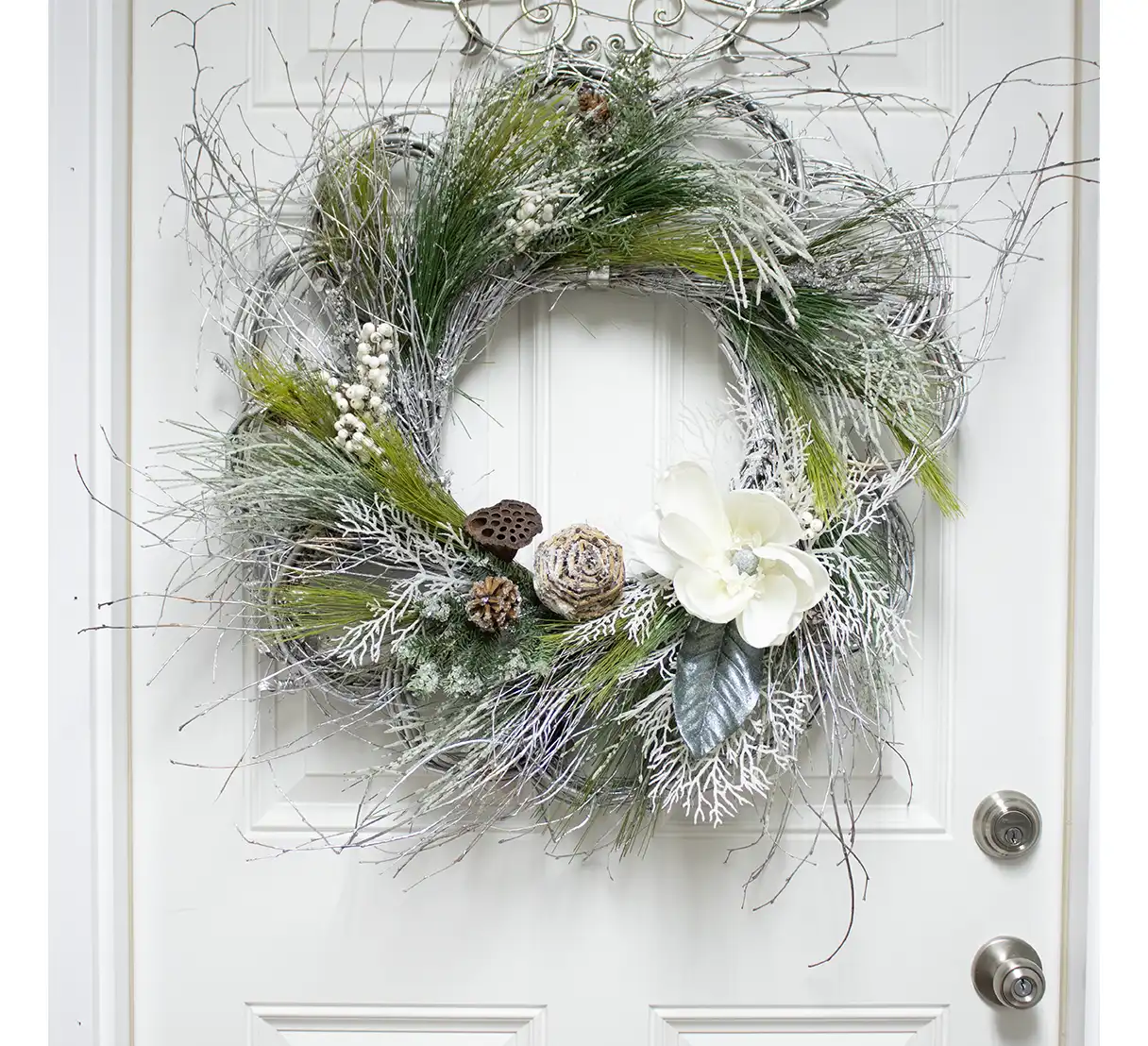 Durable and crafted with care, this wintery silk wreath is a timeless addition to your seasonal decorations. Whether displayed indoors or out, it evokes the cozy charm and quiet beauty of the season.