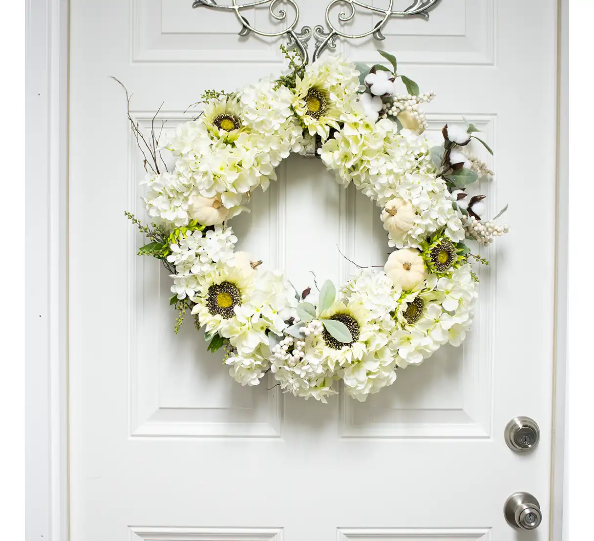 This wreath is artfully designed on a neutral grapevine base, ensuring durability and an organic feel. Its understated yet striking palette makes it versatile for various occasions, from seasonal celebrations to everyday elegance. Perfect for a front door, mantel, or wall, this silk wreath offers a warm yet sophisticated welcome. Its timeless design ensures it will remain a cherished piece of decor for years to come.