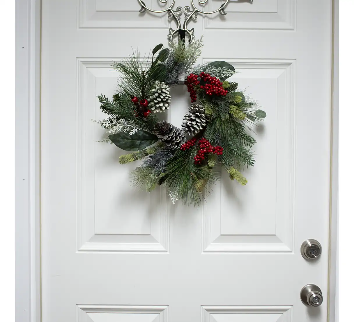 This wreath’s simple yet sophisticated design makes it versatile for various decor styles, from traditional to modern. Whether displayed on a front door to warmly welcome guests or hung indoors to enhance a cozy winter atmosphere, this wreath is a lasting seasonal statement. Durable and beautifully crafted, it’s a timeless addition to your winter decor, blending the freshness of evergreens with the festive joy of red berries.