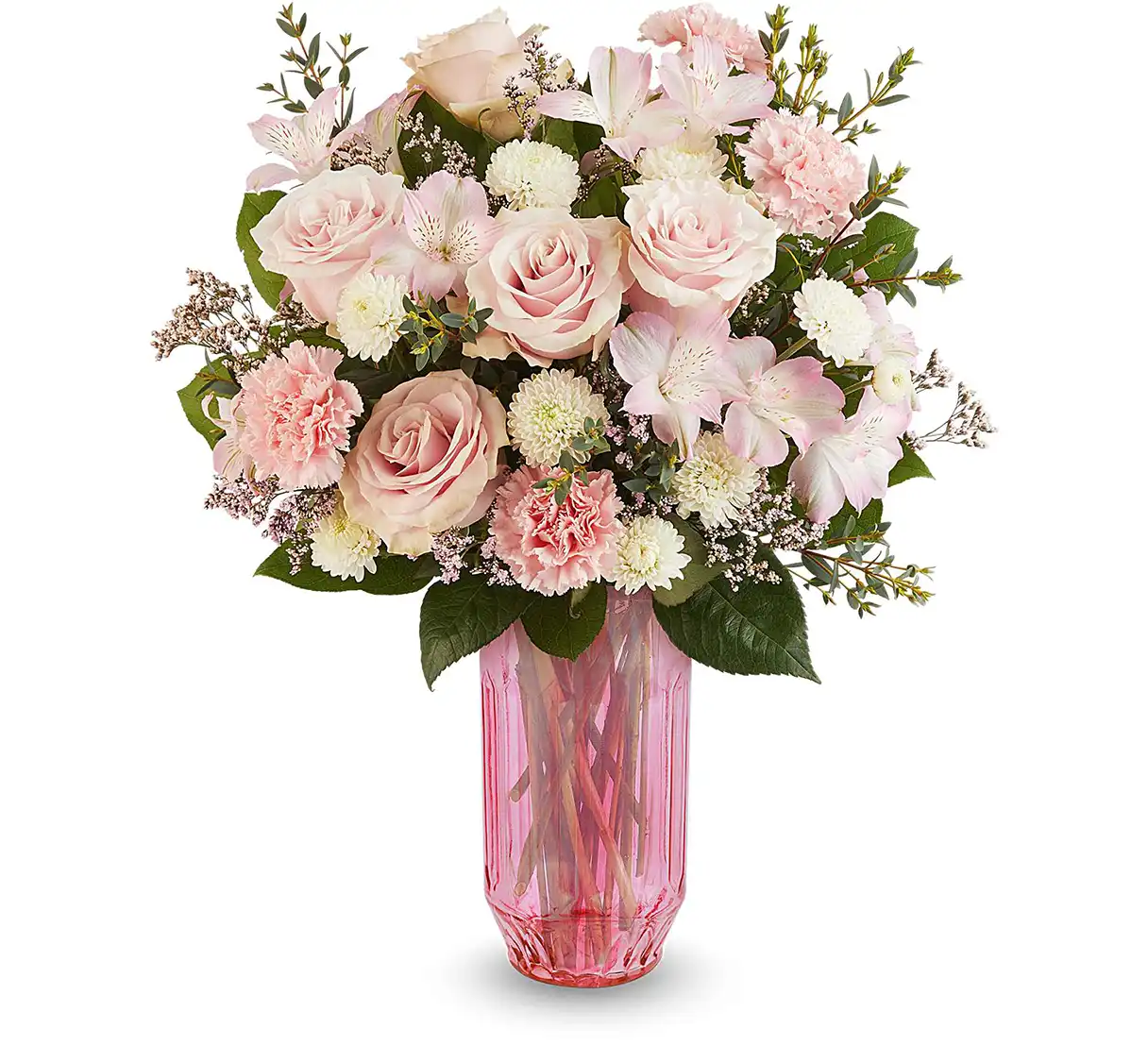 A pink floral bouquet with roses, alstroemeria, and carnations accented with white chrysanthemums and greenery in a pink glass vase.