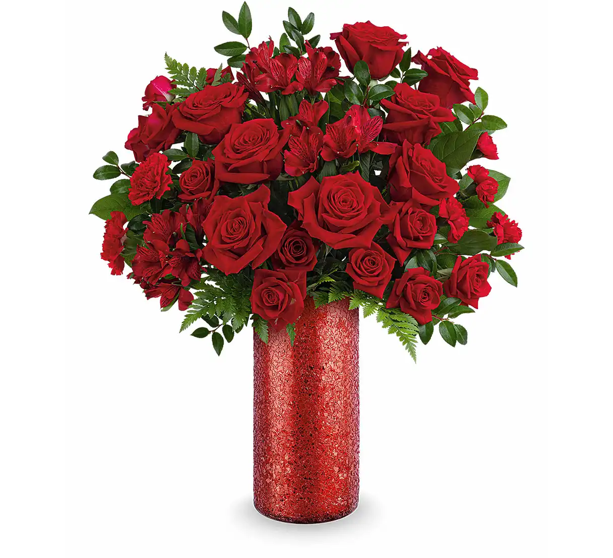 Red rose and carnation bouquet with mixed red blooms in a red glass vase.